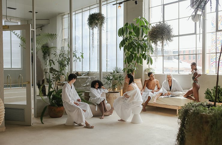 A group of people in robes about to get the best massage in Melbourne.
