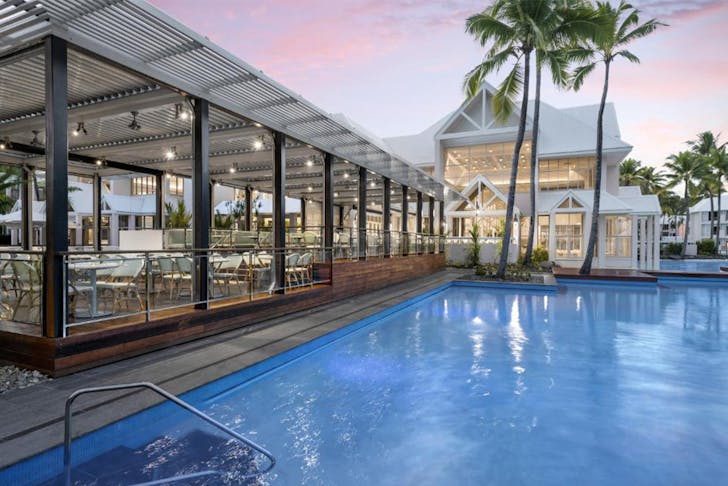 a restaurant by a pool at Sheraton Grand Mirage Port Douglas