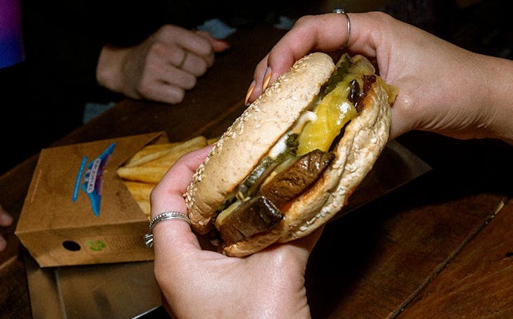 Person holds shroom shroom burger
