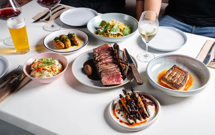 a table full of plates of different food