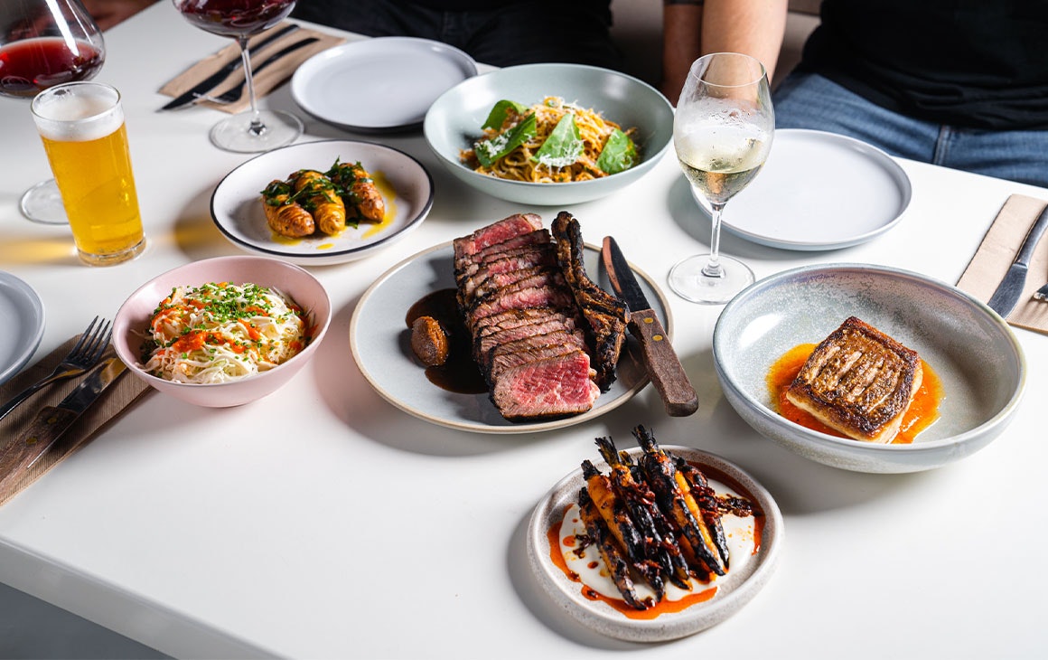 a table full of plates of different food