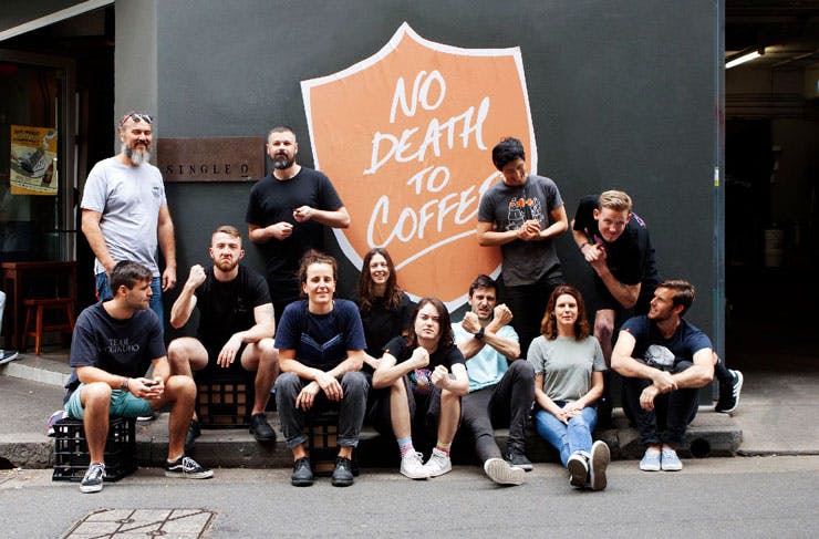 Staff from Single O pose in front of a 