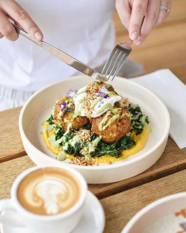 A bright and colourful breakfast at Sister cafe in Hawthorne, with hash brown balls and spinach. 