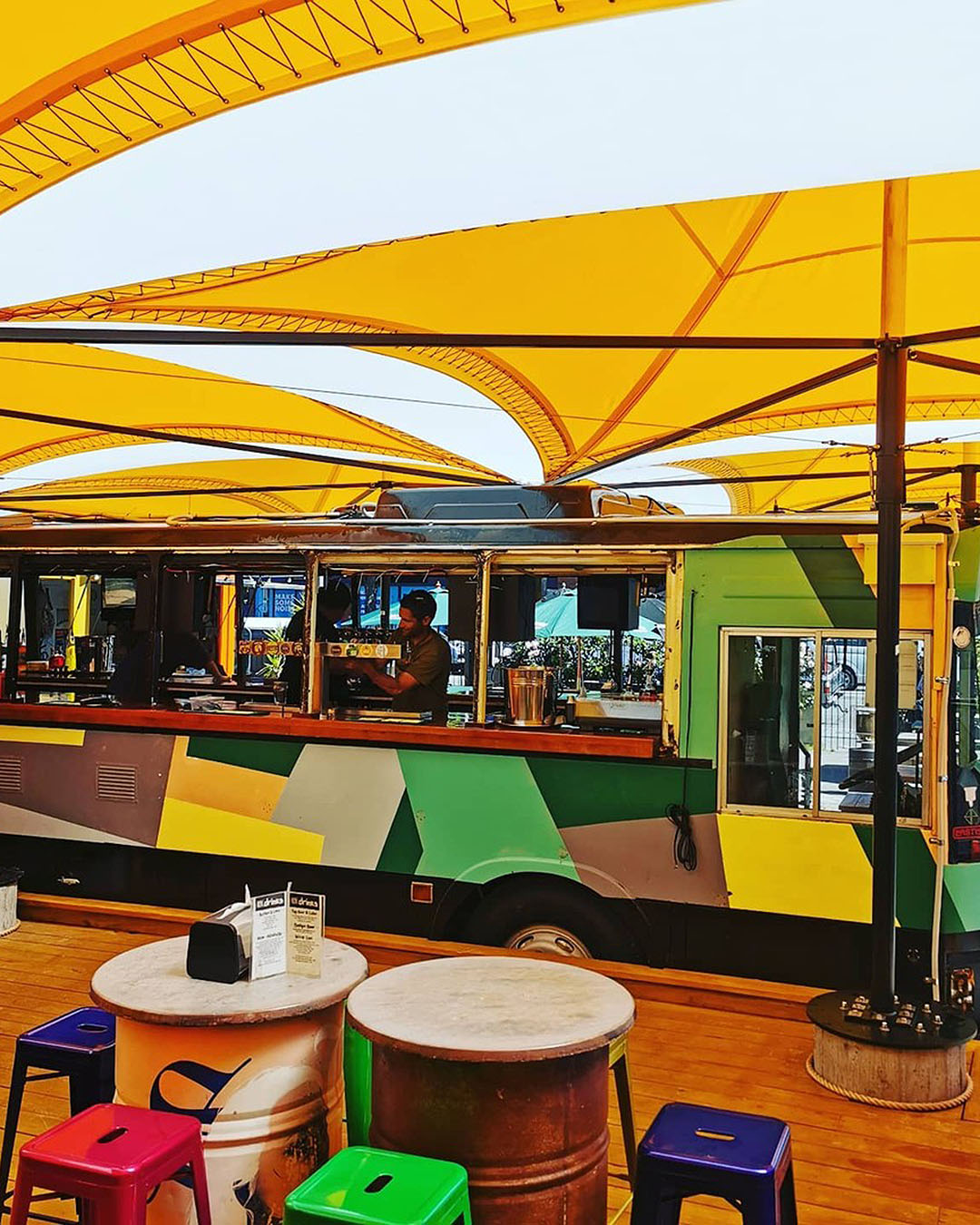 Colourful yellow awning covers the bus bar at Smash Palace, one of the best bars in Christchurch.