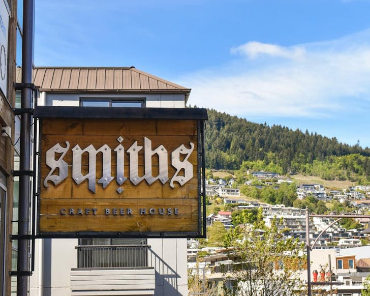 Smith's Craft Beer House sign with mountain views behind