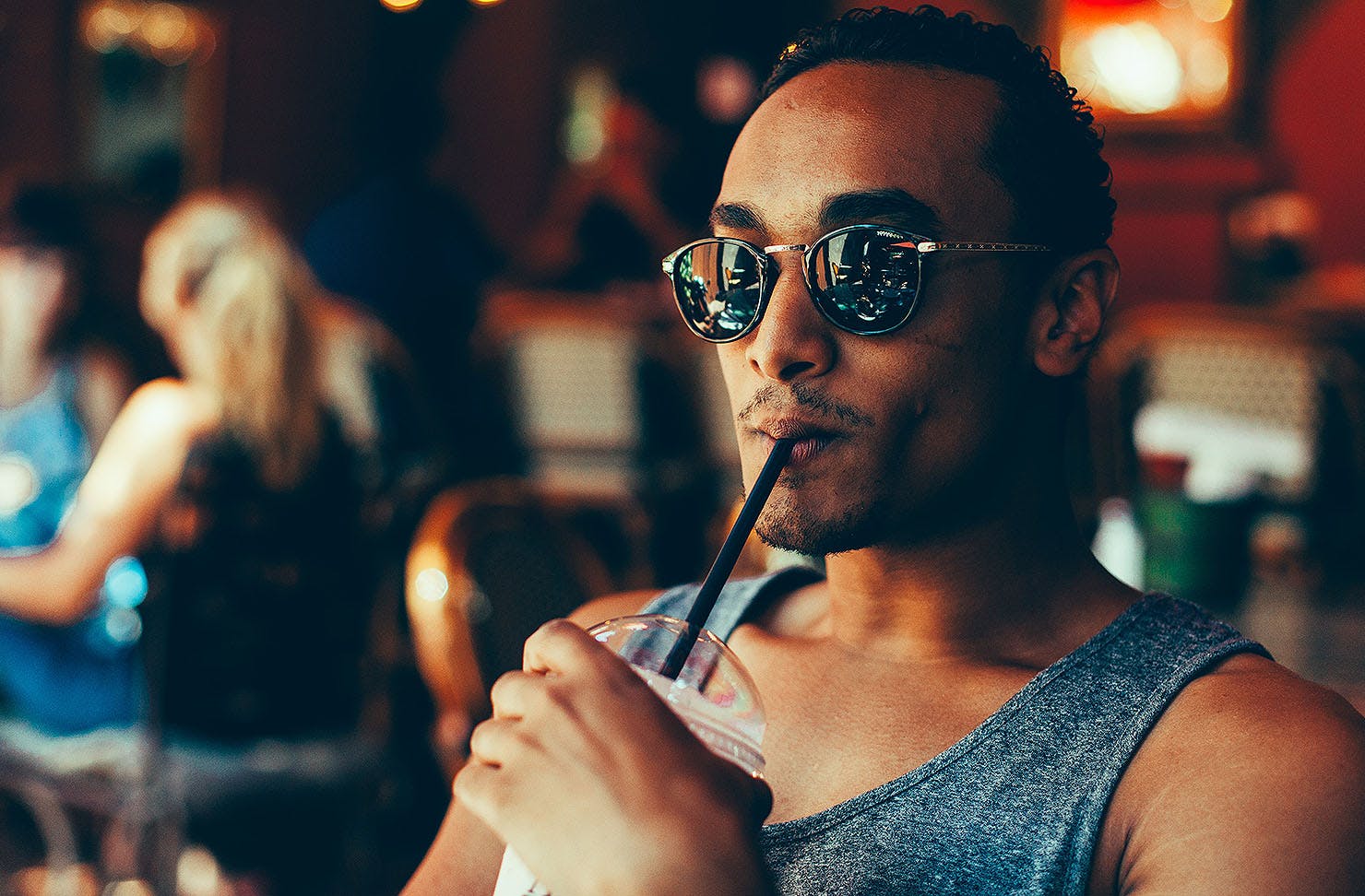 A man drinking a smoothie.