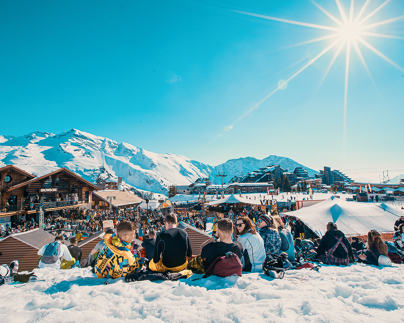 Partygoers take five on the beautiful slopes at Treble Cone.