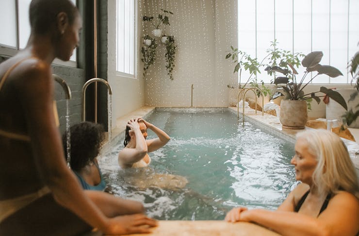 People relaxing in a bath house.