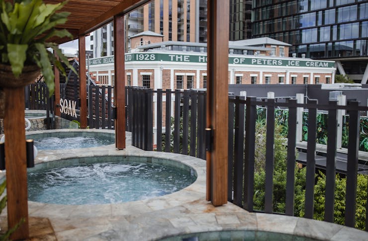 spas on the edge of a rooftop venue