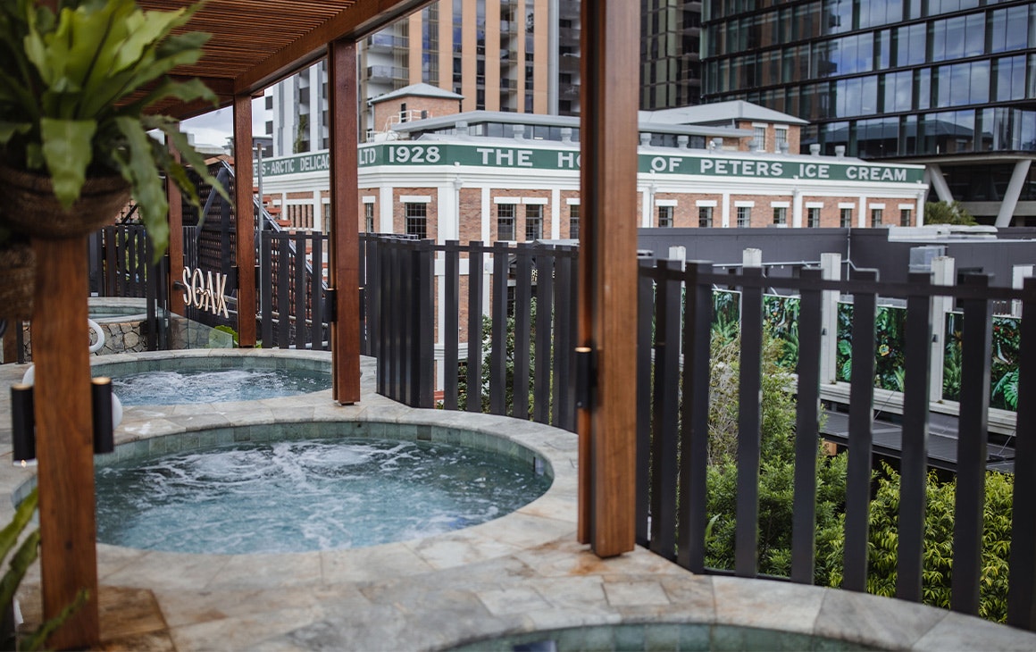 spas on the edge of a rooftop venue