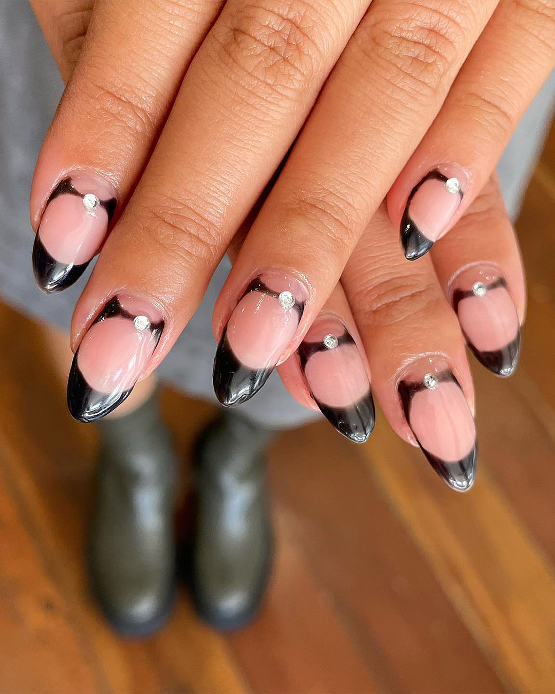 Someone shows off their black-tipped nails by Society, one of Auckland's best nail salons.