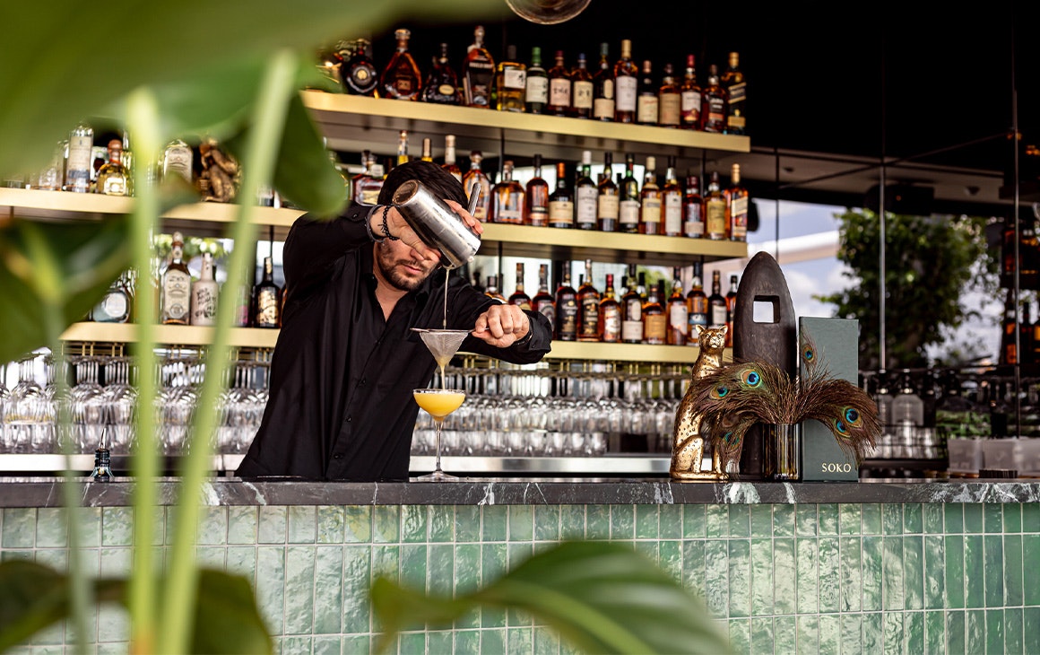 a green tiled bar