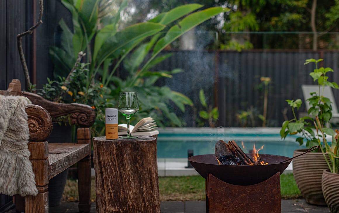 a fireplace in front of a pool