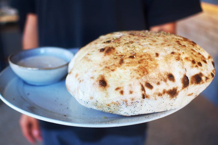 Wood fired bread and dipping sauce at Somedays Pizza.