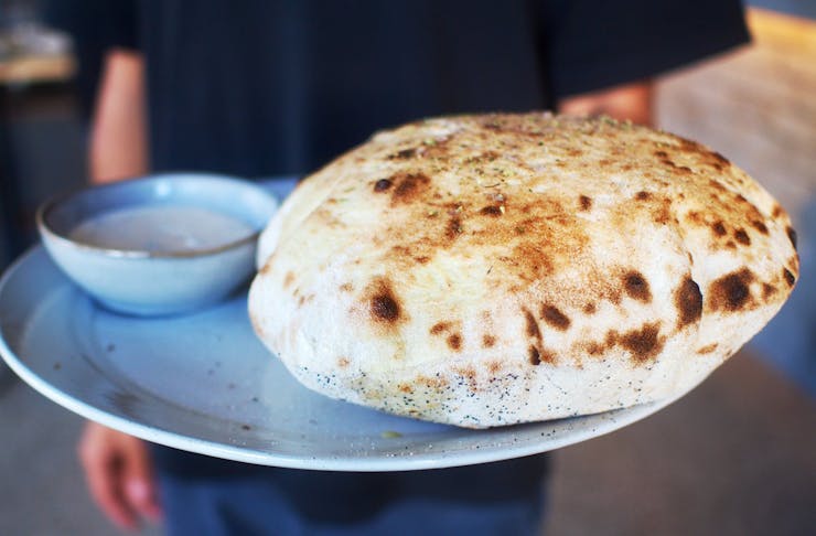 Wood fired bread and dipping sauce at Somedays Pizza.