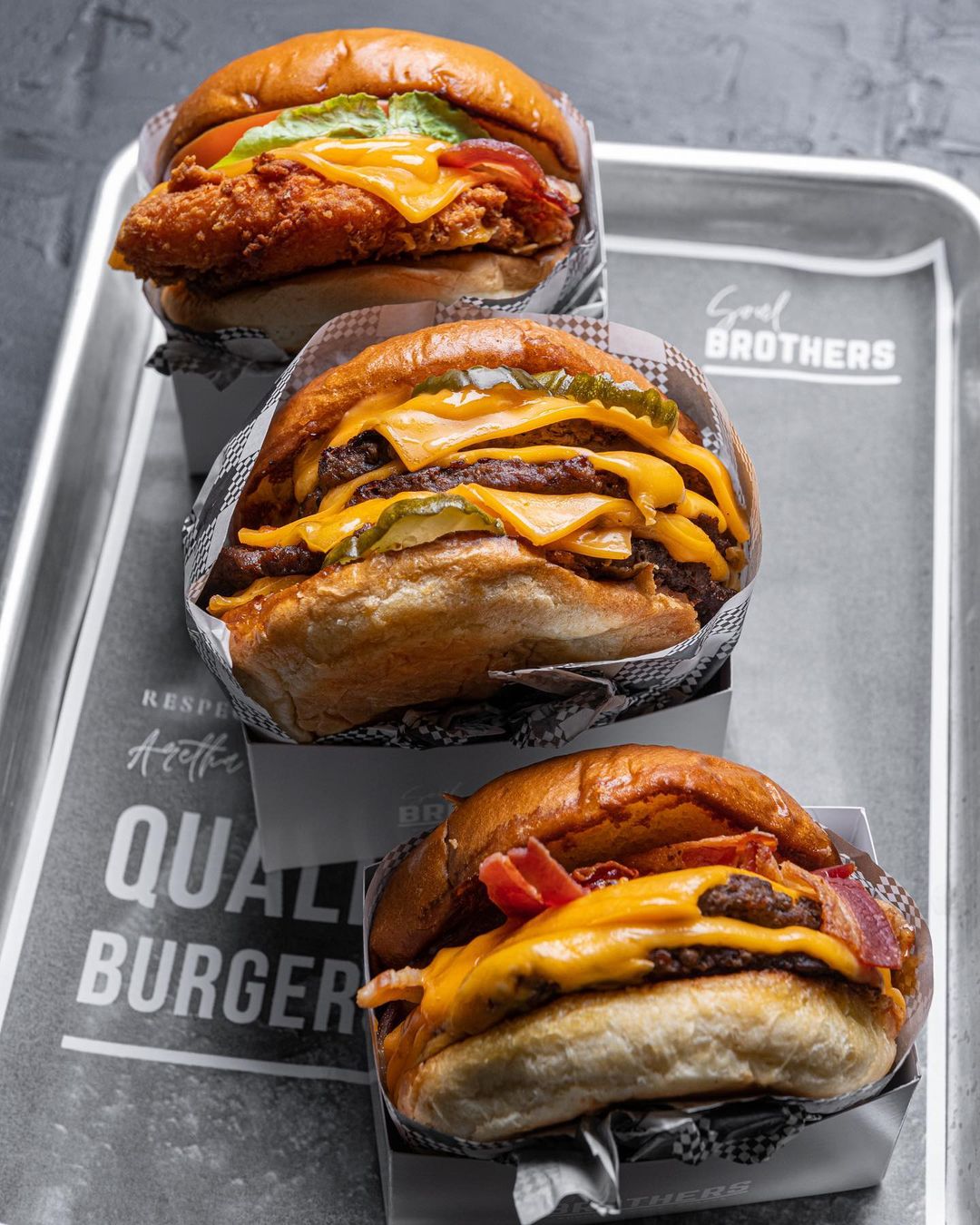 three burgers on a tray