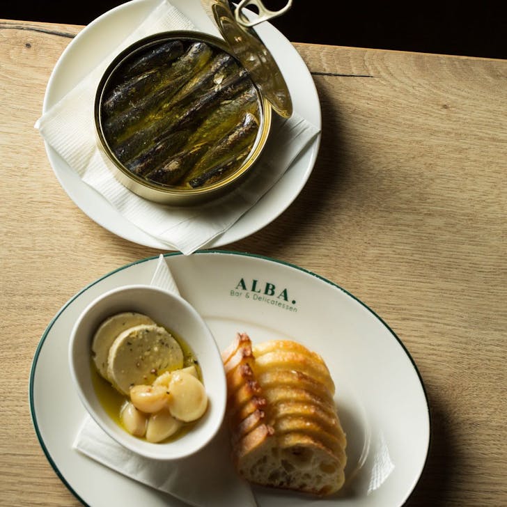 a plate of bread and sardines