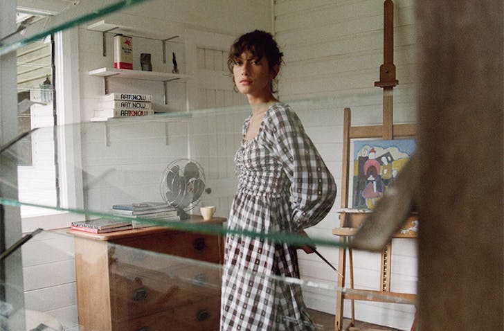 a woman looking through a window