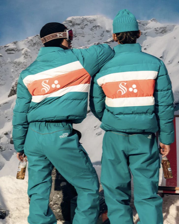 Two people are kitted out in puffer suits by Steinlager and Huffer.