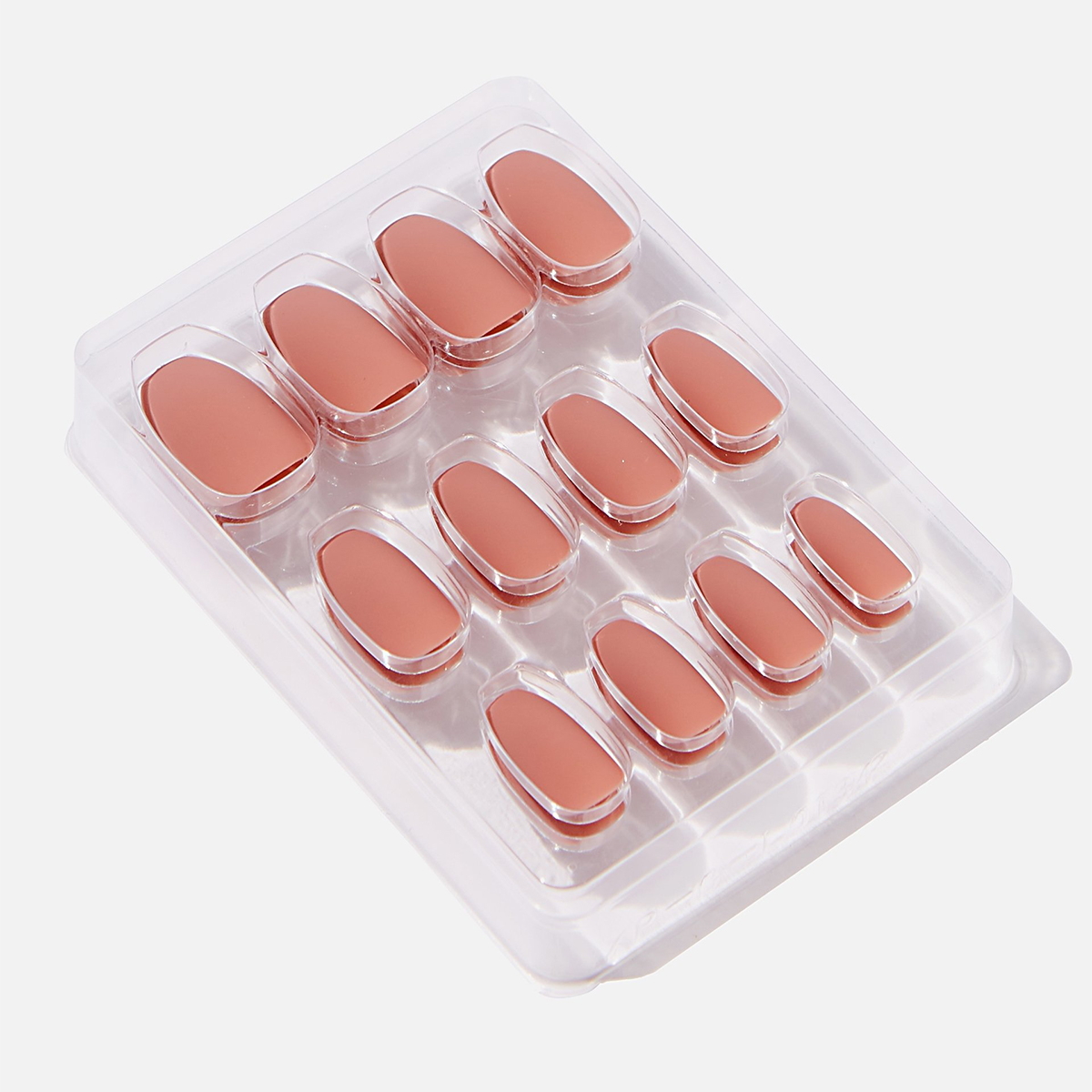 Clear plastic packet of 12 stick on nails in blush pink.