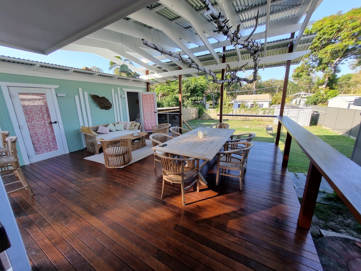 a stradbroke island accomodation with a covered deck