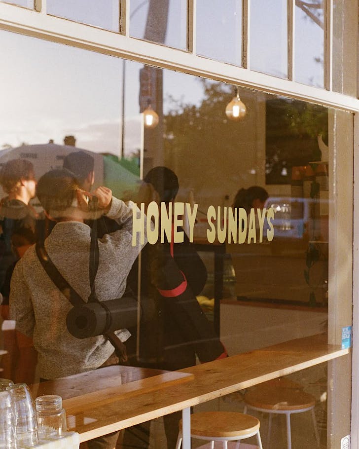 Stretchy morning attendeeds get coffee inside Honey Sundays.