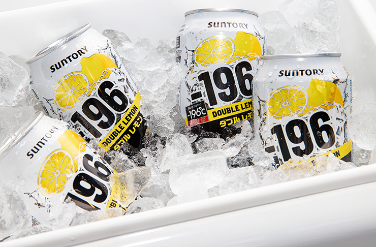 Four white and yellow cans of alcohol in a tub of ice.