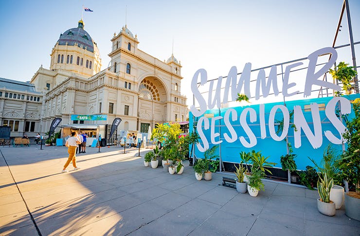 A large sign out the front of the Melbourne Museum reading 
