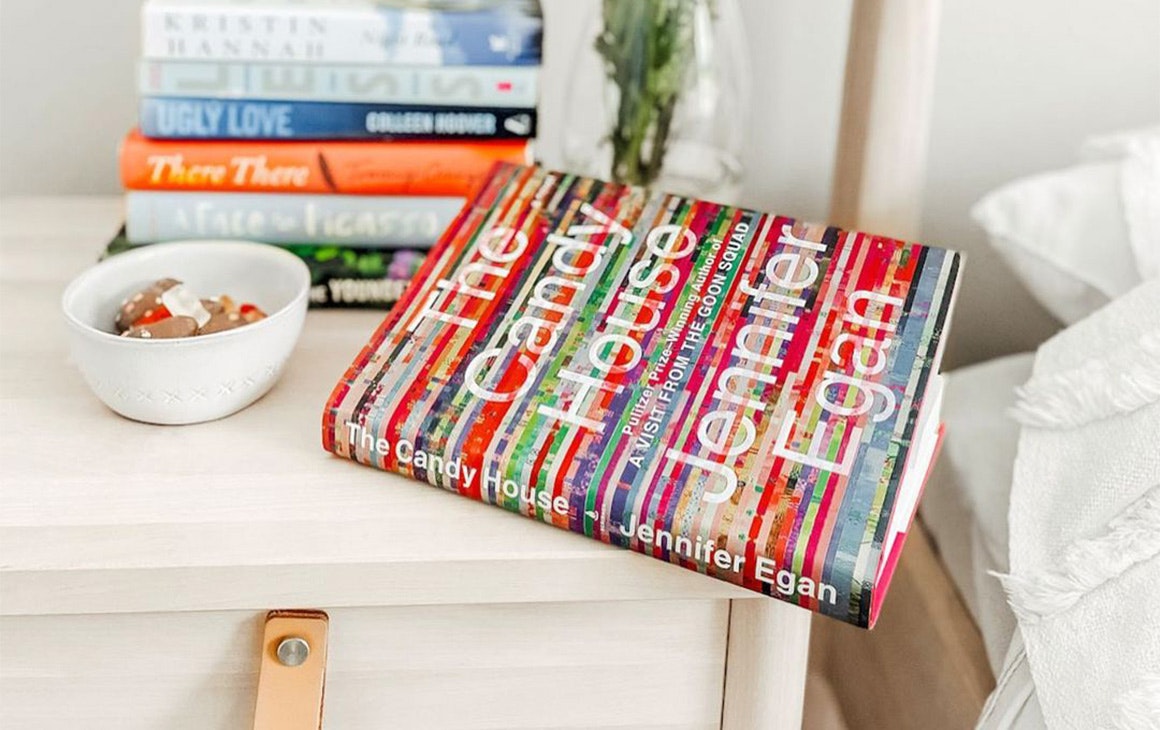 a book sitting on a bedside table