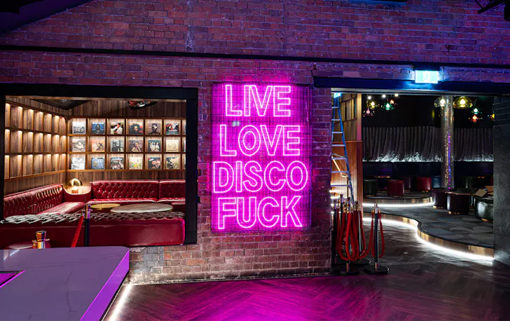 a neon light that says live love disco