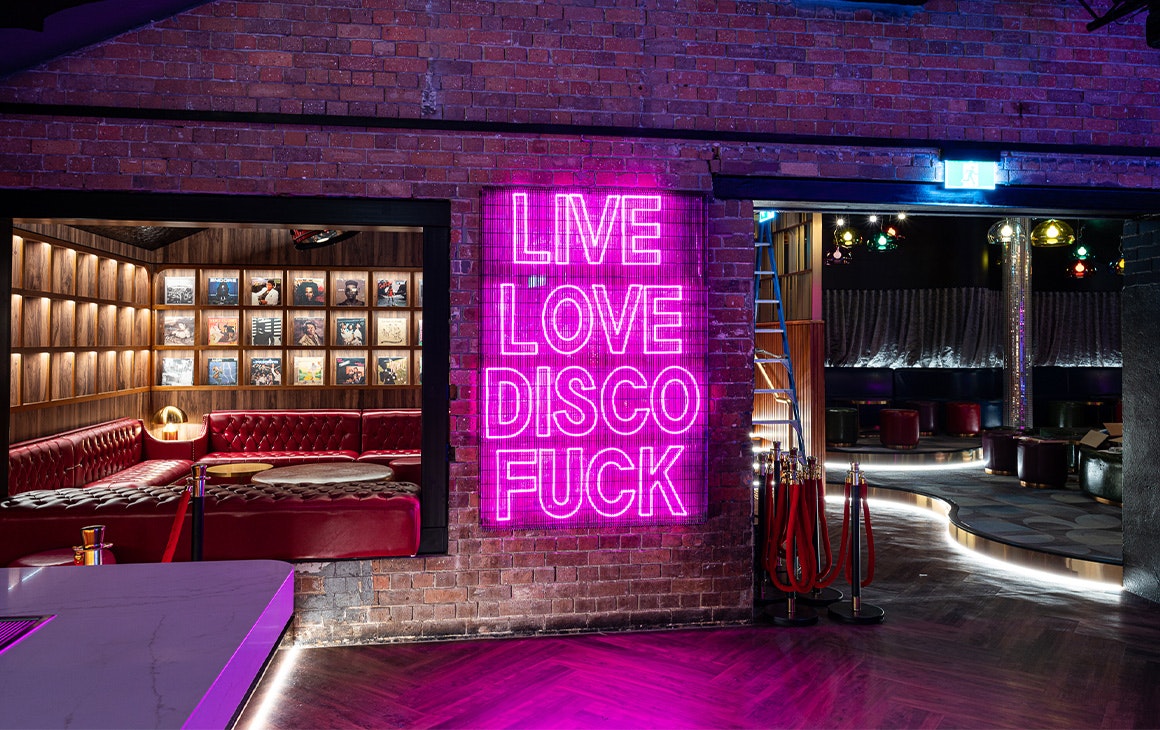 a neon light that says live love disco