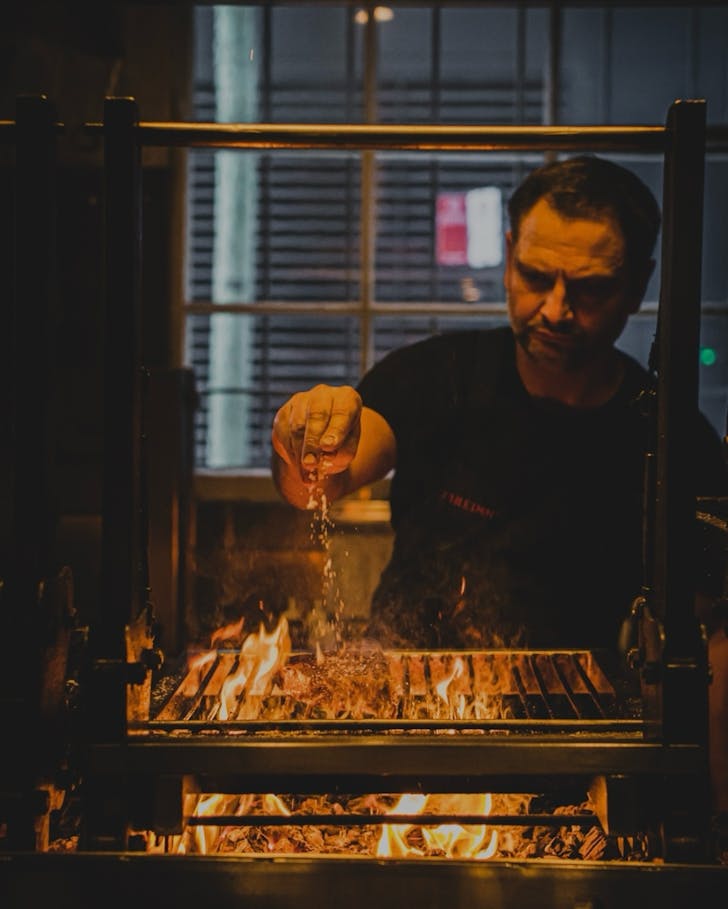 chef lennox hastie seasons a steak at surry hills restaurant firedoor