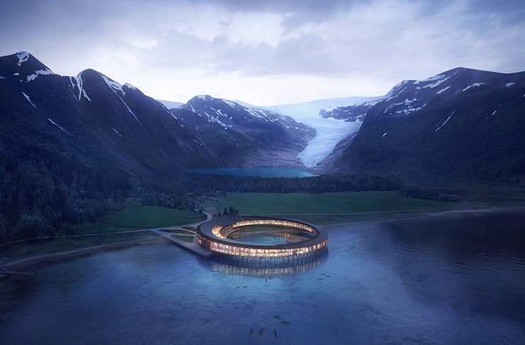 A ring-shaped hotel positioned above a lake in Norway.