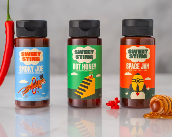 Three bottles of Sweet Sting toppings.