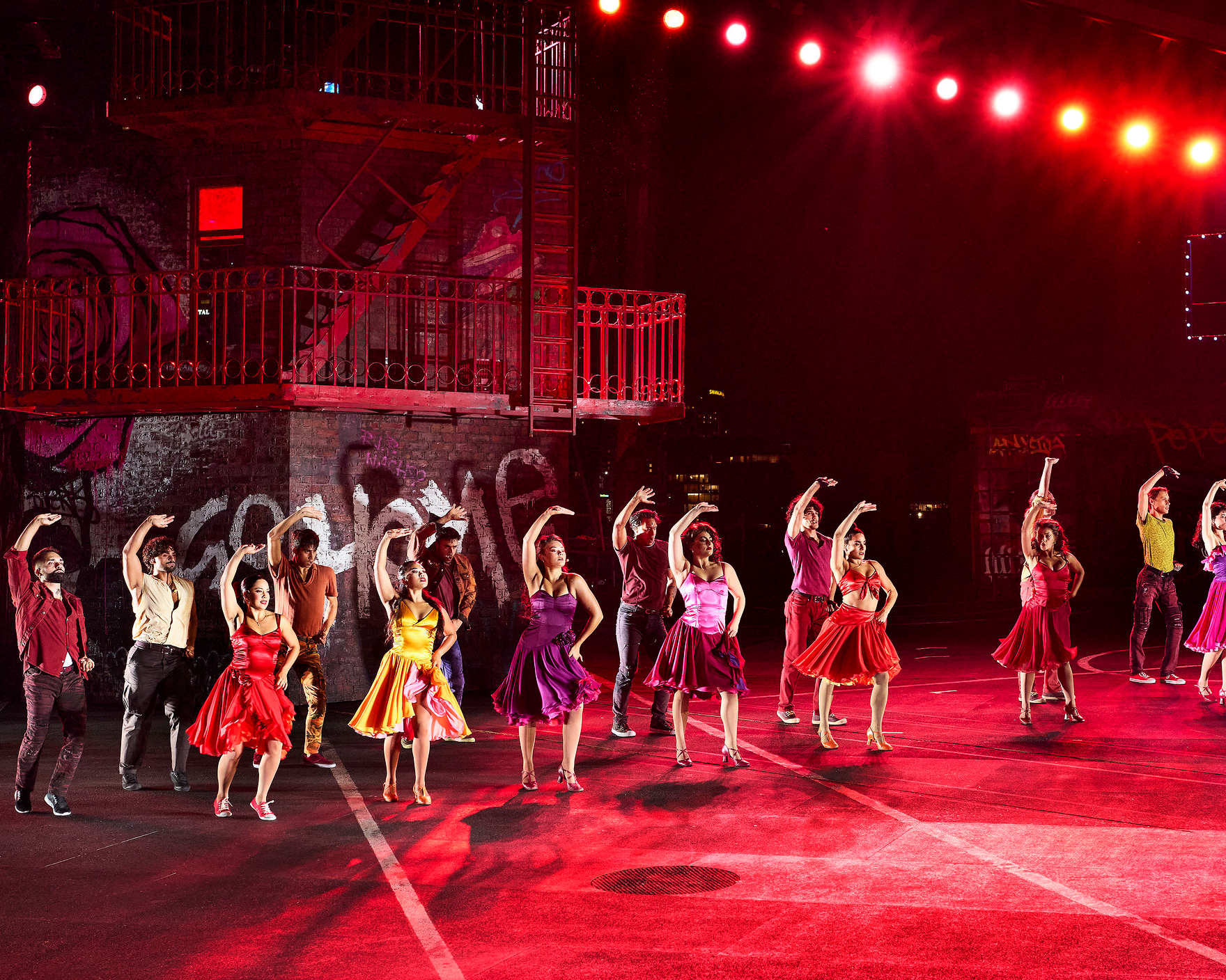 West Side Story cast on stage on Sydney Harbour