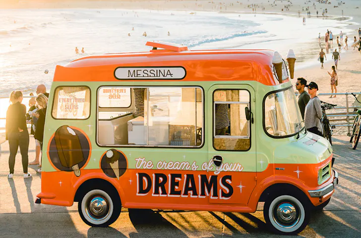 The Messina food truck parked at Bondi Beach on a sunny day. 