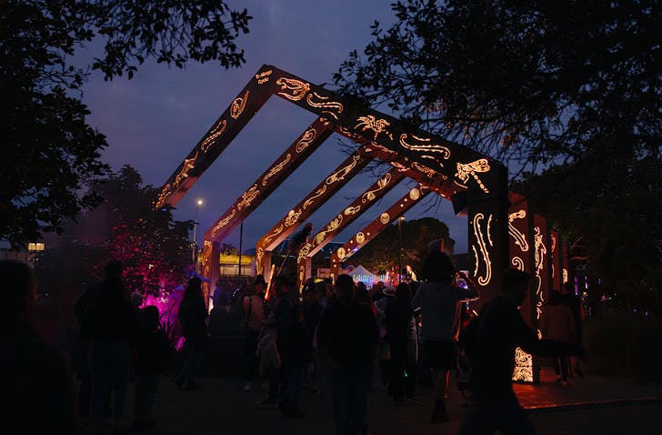 A traditional set of Māori atrium lit up in traditional designs for the Takapuna Lights Show.