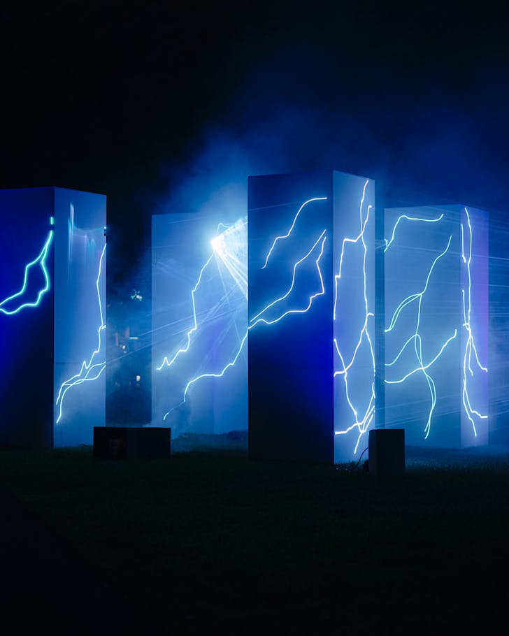 Obelisks of Takapuna Winter Lights show light up in blue electrical bolts.