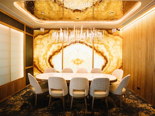 a private dining table under a chandelier at tama brisbane