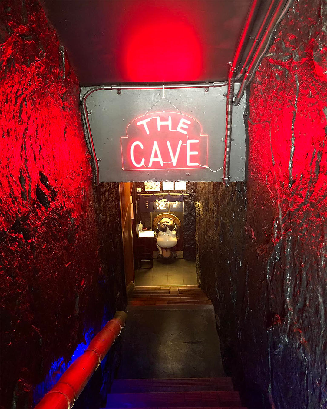 The neon-lit entrance to Tanuki's Cave.