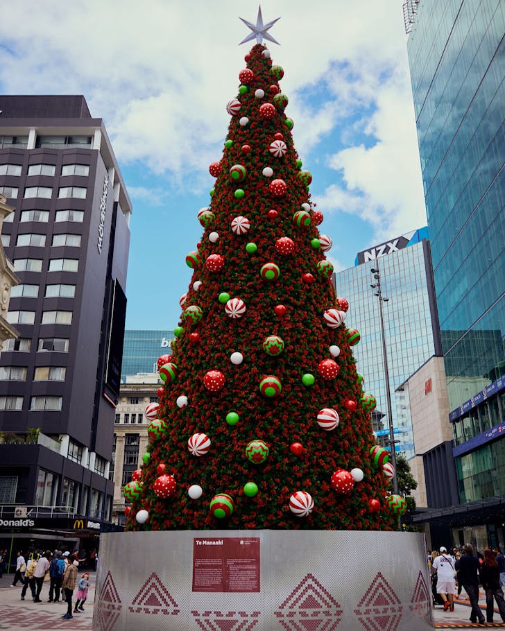 A giant 18 metre tall tree, covered in baubles and pohutukawa decorations. 