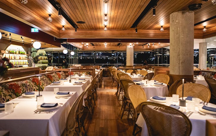 interior of tillerman, with a mix of seating and wood panelled ceilings