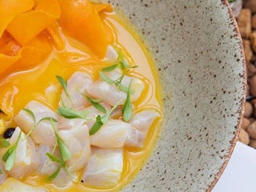 A bowl of a vegan dish that looks like sashimi