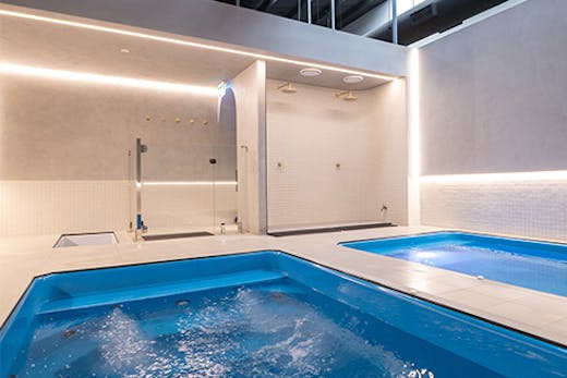 two pools in a white room