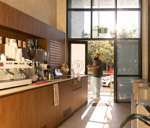 The wood-panelled espresso bar at The Bearded Baristaa
