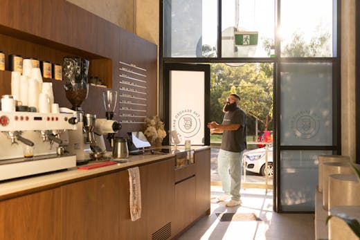 The wood-panelled espresso bar at The Bearded Baristaa