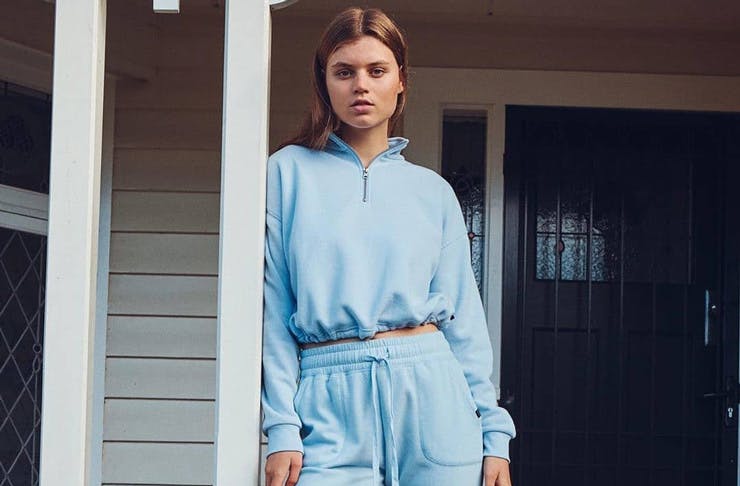 A model wearing a blue matching tracksuit set, available to shop at The Iconic. 