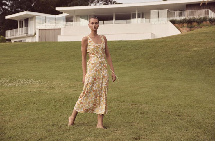 A model wearing a patterned maxi dress from LOVER