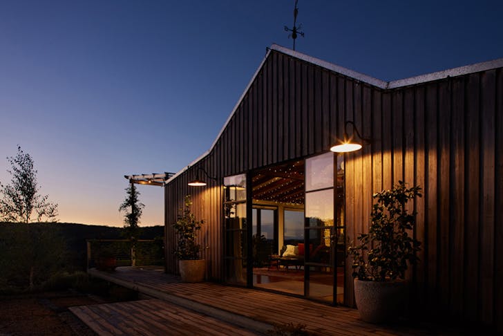 The Machinery Shed cabin Airbnb at dusk