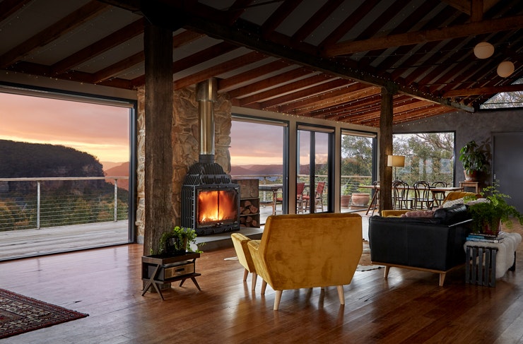 The deck and view from The Machinery Shed cabin Airbnb at sunset